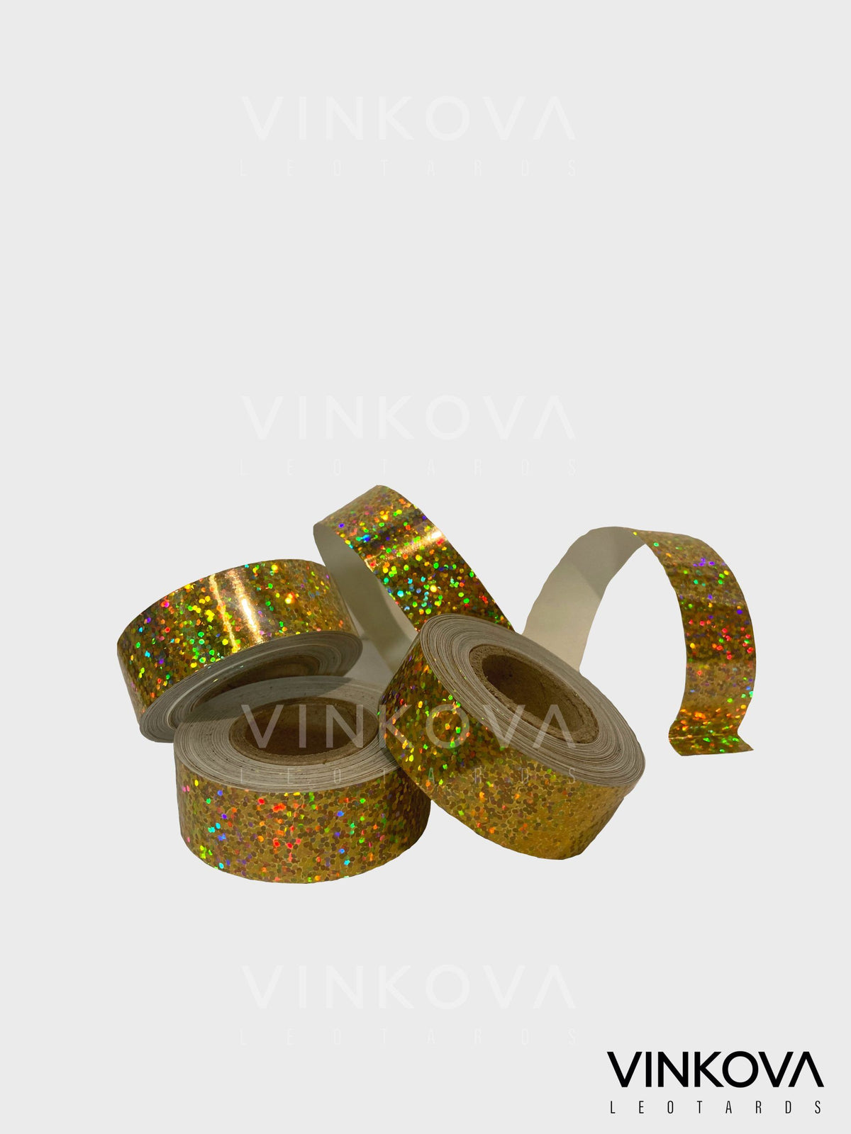 Vinkova Klebeband für RSG-Handgeräte, glitzernd, gold, in Rollen und ausgerollten Streifen.